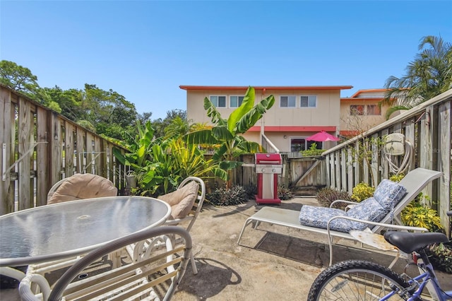 1655 58th Ter S Unit 1, Saint Petersburg, FL 33712 - view of patio / terrace featuring a fenced backyard and outdoor dining area