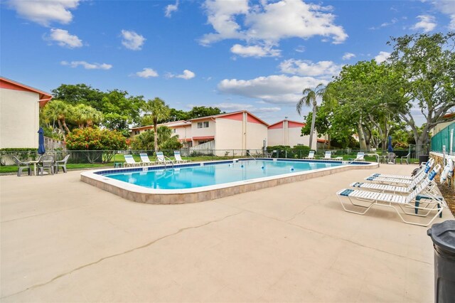 view of swimming pool with a patio