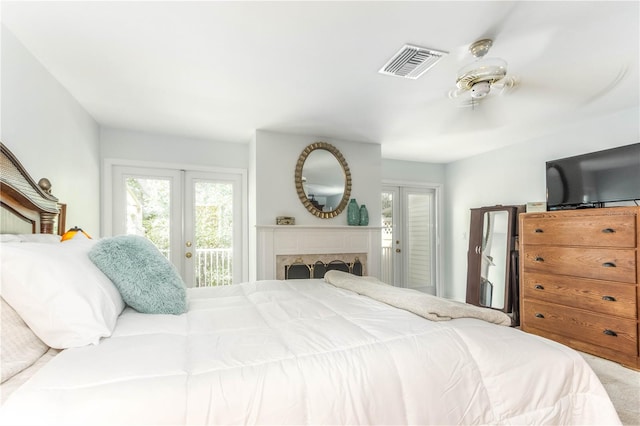 bedroom featuring carpet floors, access to outside, and french doors