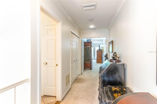 hall with light carpet and crown molding