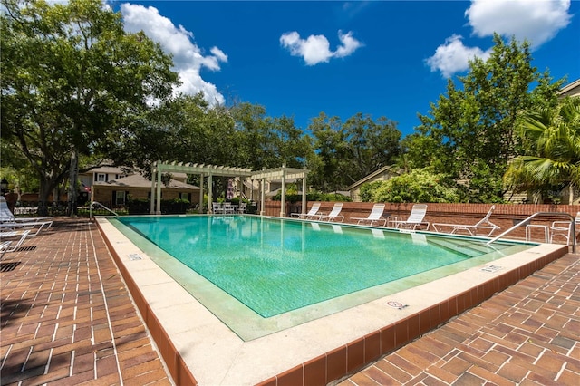 view of swimming pool with a pergola and a patio area