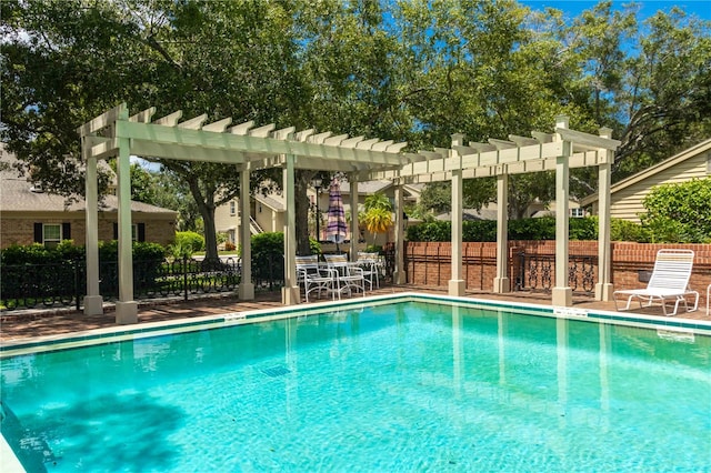 view of swimming pool featuring a pergola