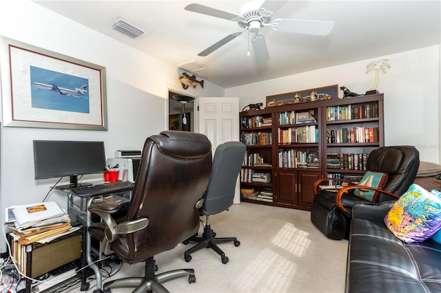 office area featuring light carpet and ceiling fan