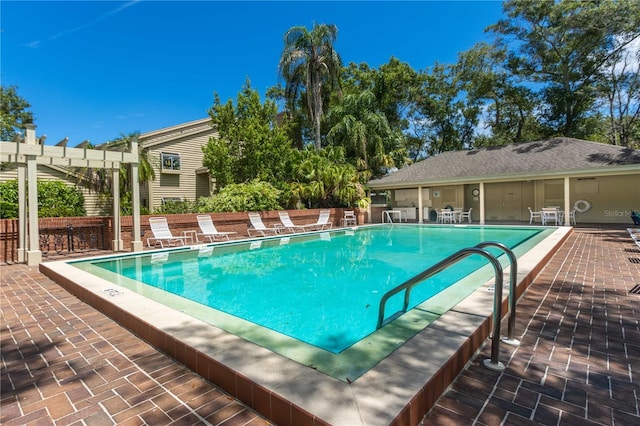 view of pool featuring a pergola and a patio