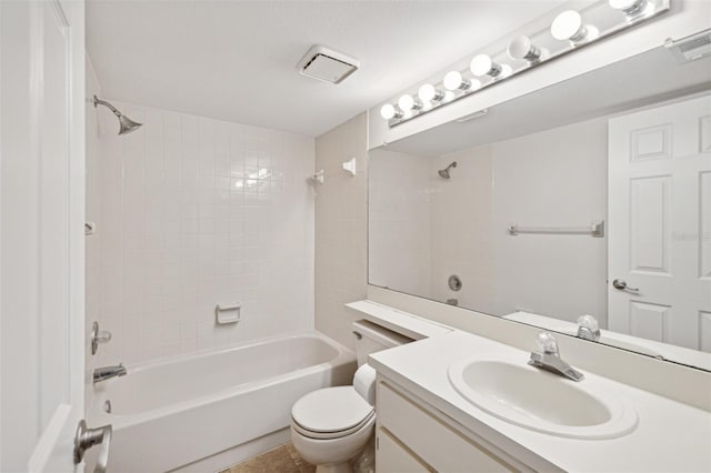 full bathroom with vanity, toilet, and tiled shower / bath combo