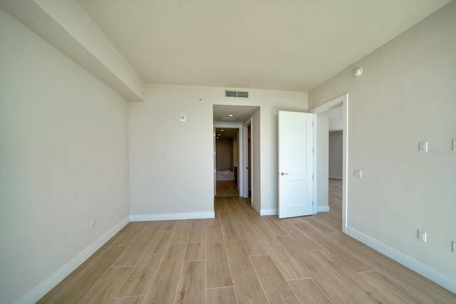 spare room featuring light wood-type flooring