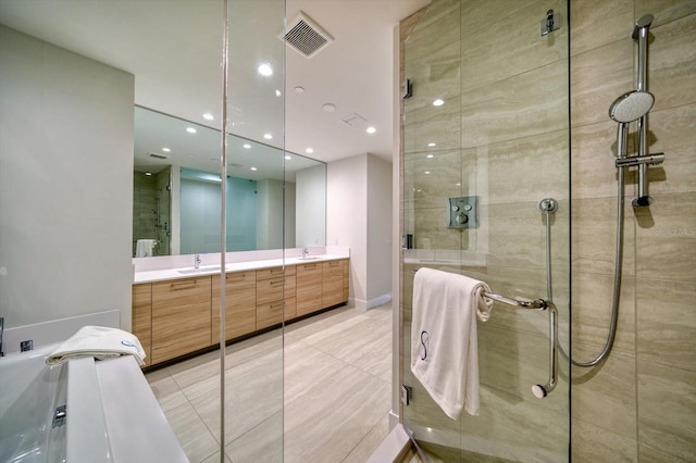 bathroom with shower with separate bathtub, tile patterned flooring, and vanity