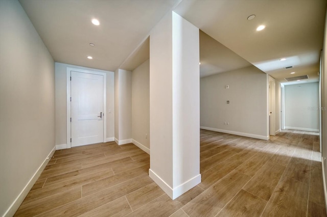 hall with light wood-type flooring