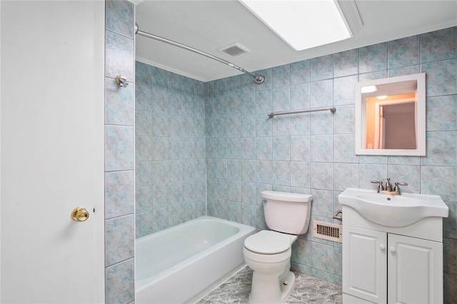 full bathroom with toilet, shower / tub combination, vanity, and tile walls