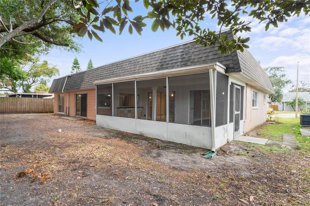 rear view of house with a sunroom