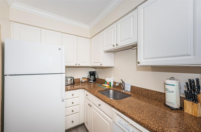 kitchen with white cabinetry and white refrigerator