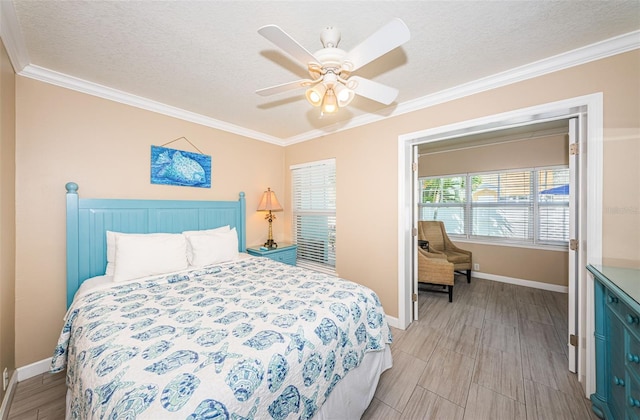 bedroom with a textured ceiling, crown molding, light hardwood / wood-style floors, and ceiling fan