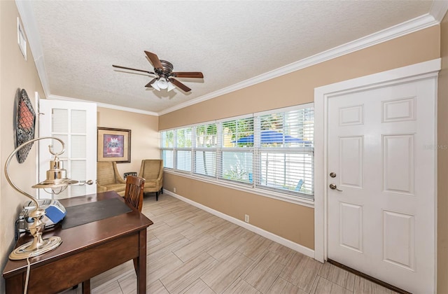 home office featuring a textured ceiling, ornamental molding, and ceiling fan