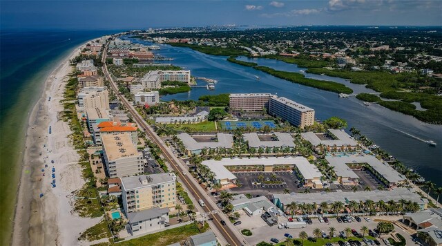 drone / aerial view featuring a view of the beach and a water view