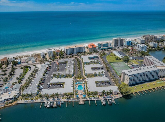 drone / aerial view featuring a water view and a view of the beach