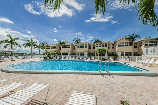 view of swimming pool featuring a patio area