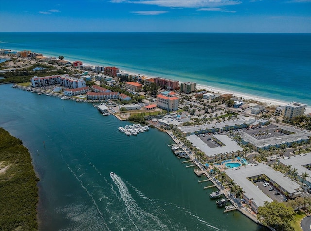 aerial view with a water view and a beach view