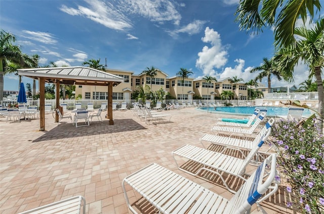 view of swimming pool with a gazebo and a patio area