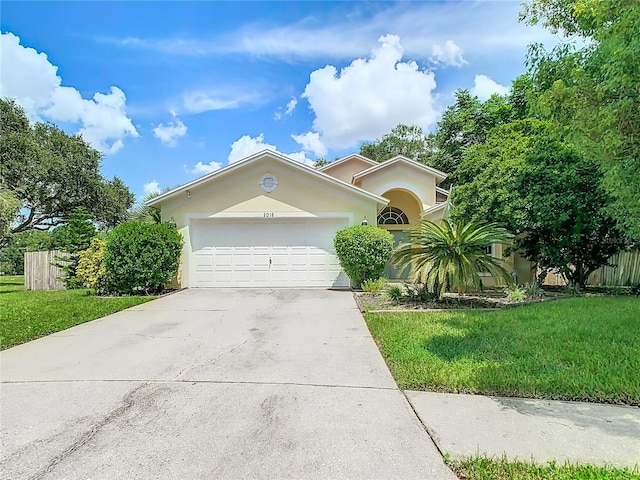 view of front facade with a garage and a front lawn