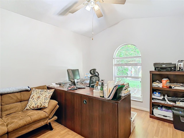 office space with light wood-type flooring, lofted ceiling, and ceiling fan