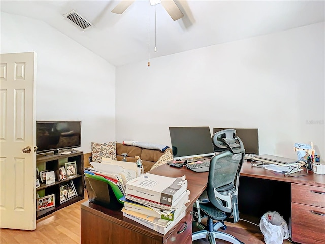 office area with light hardwood / wood-style floors, ceiling fan, and vaulted ceiling