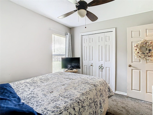 carpeted bedroom featuring a closet and ceiling fan