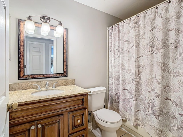 bathroom featuring vanity, toilet, tile patterned floors, and a shower with curtain