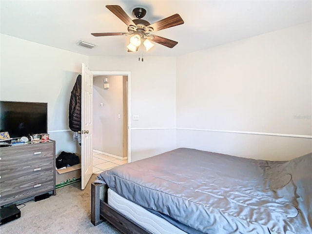 bedroom featuring ceiling fan and light colored carpet