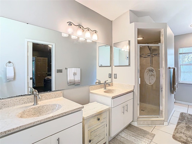 bathroom featuring tile patterned floors, walk in shower, and vanity