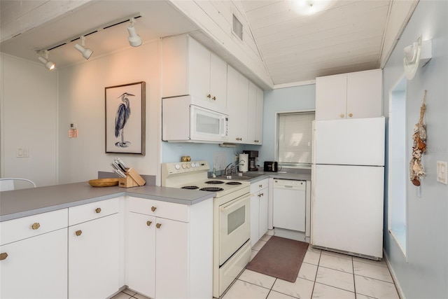 kitchen with white cabinetry, white appliances, light tile patterned floors, track lighting, and sink