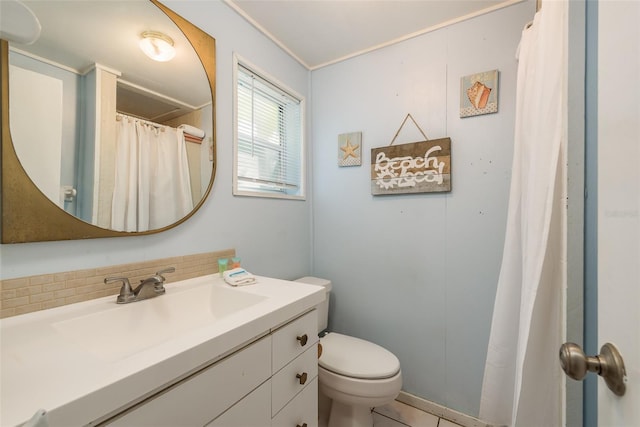 bathroom featuring vanity, toilet, crown molding, tile patterned flooring, and decorative backsplash