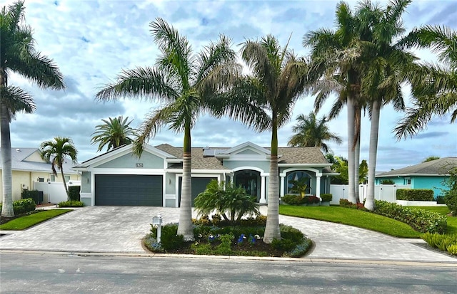 view of front facade featuring a front lawn and a garage