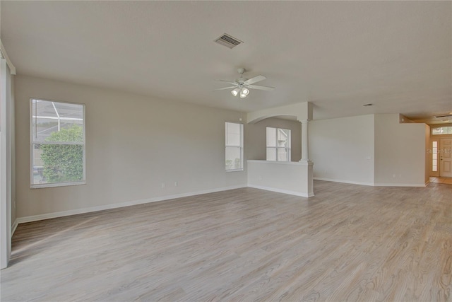 7110 Moss Ledge Run, Land O Lakes, FL 34637 - empty room with ceiling fan, visible vents, a healthy amount of sunlight, and light wood-type flooring