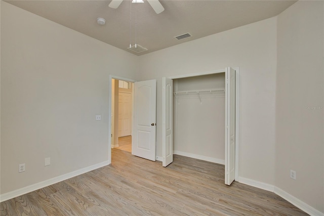 7110 Moss Ledge Run, Land O Lakes, FL 34637 - unfurnished bedroom with visible vents, light wood finished floors, and baseboards