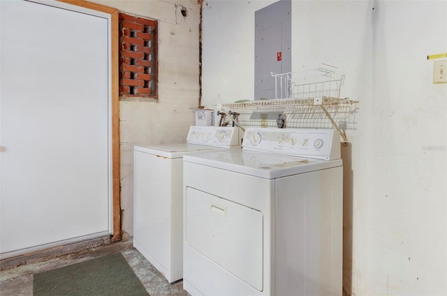 washroom with electric panel and washing machine and clothes dryer