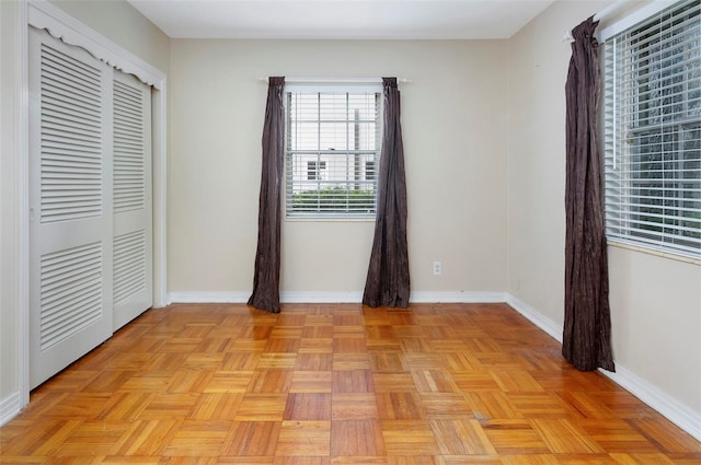 unfurnished bedroom featuring light parquet floors