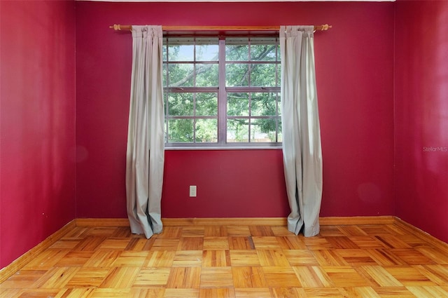 spare room featuring light parquet floors