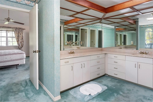 bathroom with a wealth of natural light, vanity, and ceiling fan