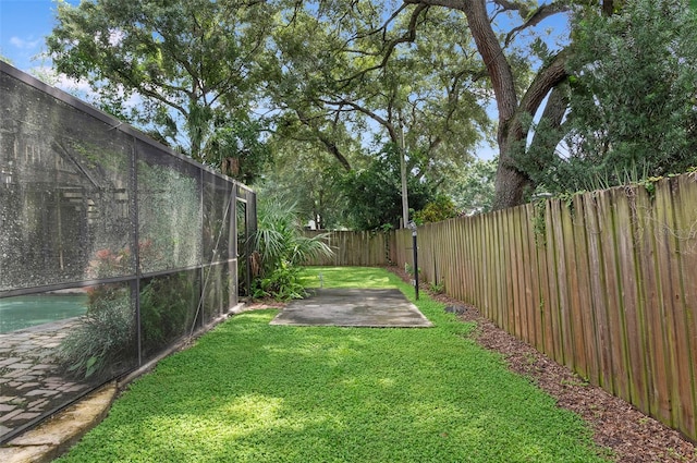 view of yard featuring a patio and a swimming pool