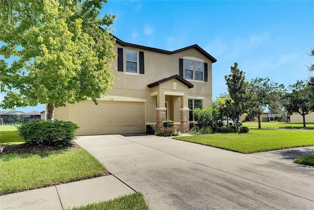 view of front facade with a garage and a front lawn