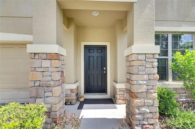 doorway to property featuring a garage