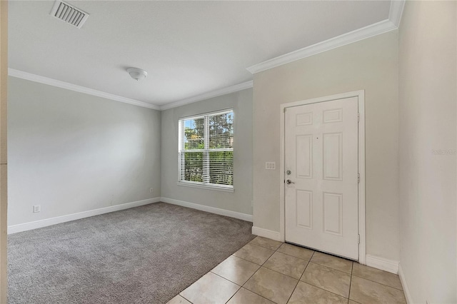 carpeted spare room with crown molding