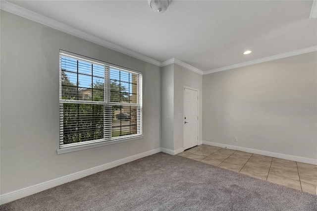 carpeted spare room with crown molding