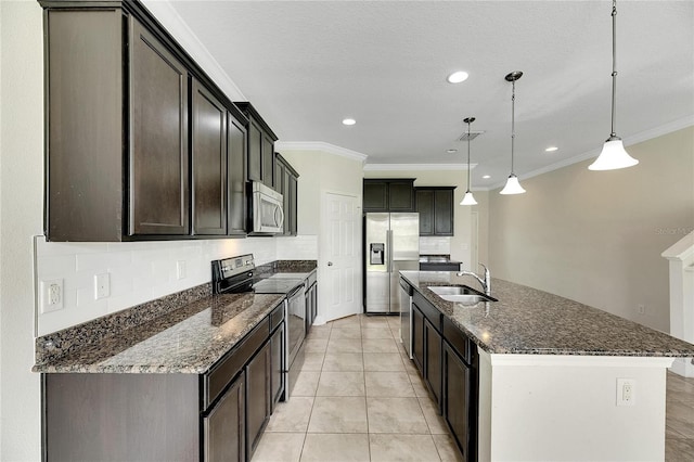 kitchen featuring an island with sink, sink, decorative light fixtures, stainless steel appliances, and crown molding