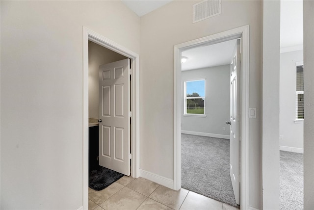 hallway with light carpet