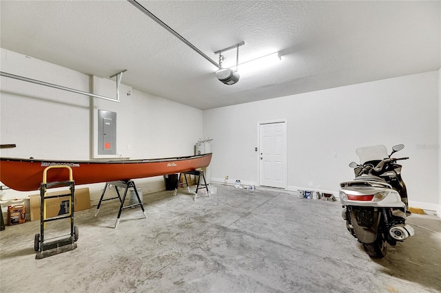 garage with electric panel and a garage door opener