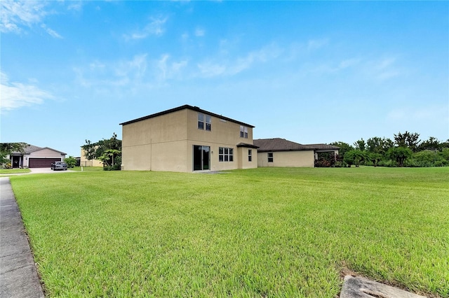 view of side of home featuring a lawn and a garage