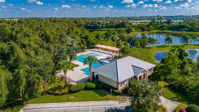 birds eye view of property with a water view