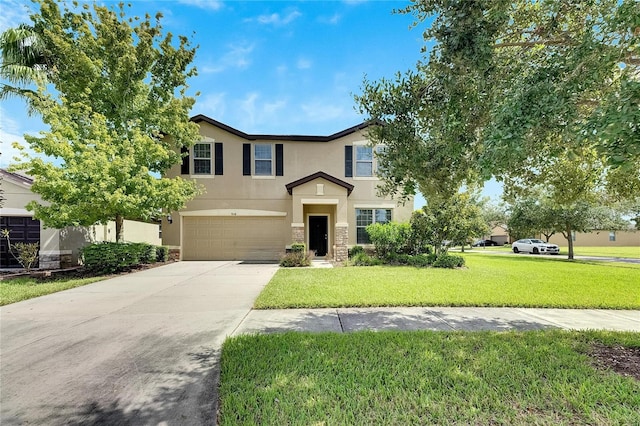 traditional home with stucco siding, concrete driveway, an attached garage, a front yard, and stone siding