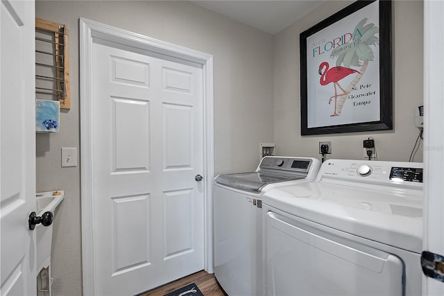 washroom featuring hardwood / wood-style floors and independent washer and dryer